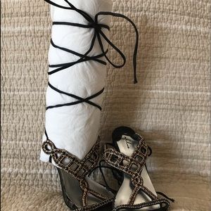 Strappy 5” heels, gold accents.